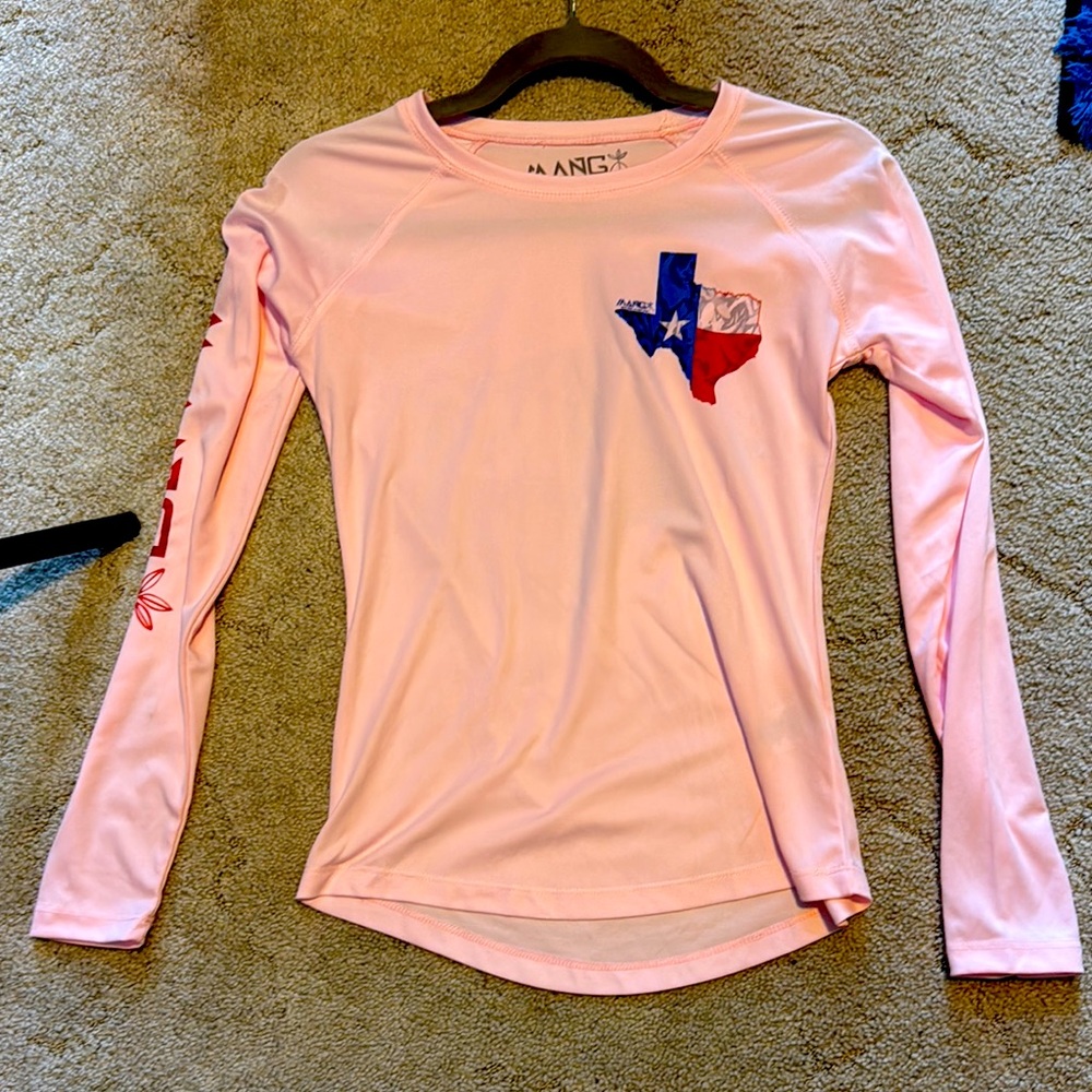 Mang never worn sun protection shirt. Women’s size XS. Pink with Texas logo.